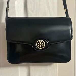Tory Burch Black Crossbody Bag with Gold Emblem and Flap Closure